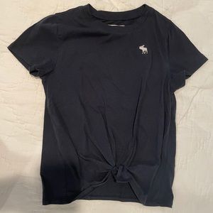 black tee tied in front